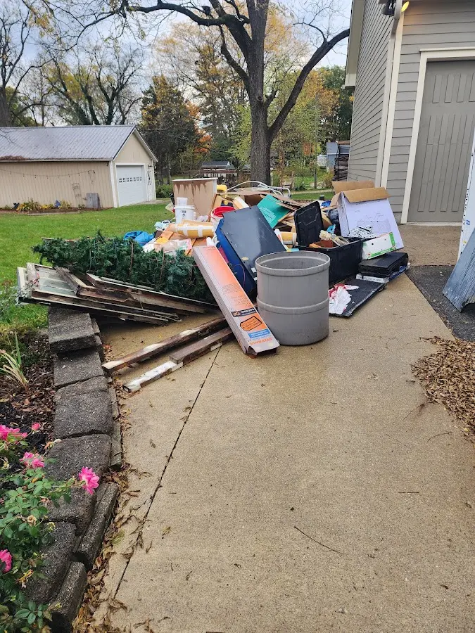 Dumpster being loaded with debris for 30 Yard Dumpster Rental in Crystal Lake